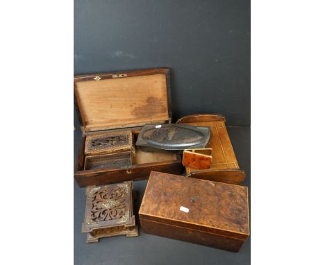 A collection of wooden and metal boxes together with a tea caddy and a cigarette case. 