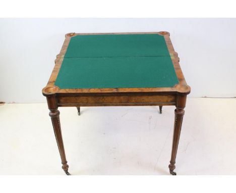 Early 19th century Figured Walnut Fold-over Card / Games Table, the shaped hinged lid with ormolu beading to edge, opening to