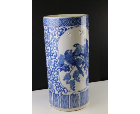 An oriental blue and white ceramic stick stand, approx 47cm in height. 