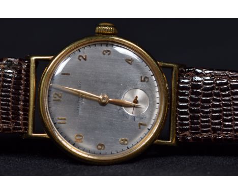 A gentleman's 18k gold Patek Philippe &amp; Co automatic wrist watch, the textured silvered dial with Arabic markers and subs