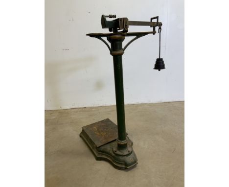 A set of potato scales with green and gilt paintwork.