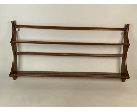 An Ercol hanging plate rack.W:96cm x D:13cm x H:49cm