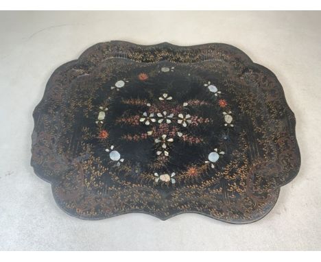 A papier-mache and mother of pearl tray. W:62.5cm x D:39cm x H:2.5cm
