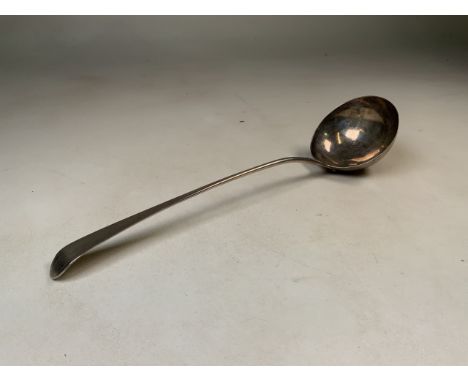 A Georgian sterling silver soup ladle approx 150g. 34cm.