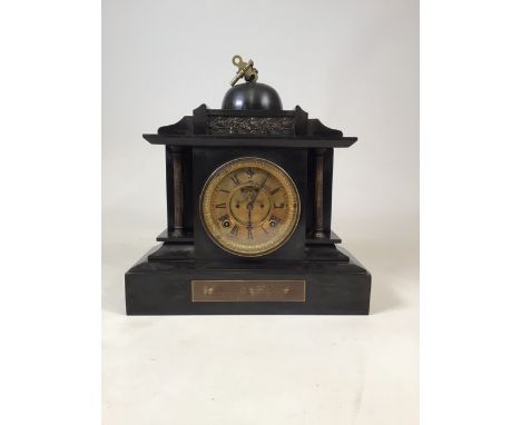 Slate eight day mantle clock with key. W:36cm x D:18cm x H:35cm