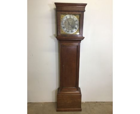 A late 18th early 19th century oak long case clock, brass dial with silvered chapter ring and gilt brass spandrel. Henry Hard