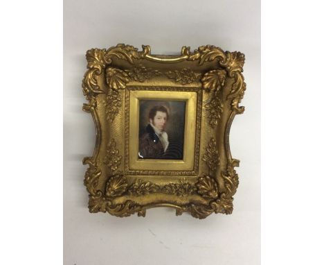 A miniature portrait of a distinguished 19th century gentleman. on white panel in gilt frame. with domed glass .Frame W:23cm 