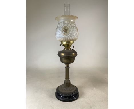 A brass and glass oil lamp with a glass shade and funnel. H:73cm.