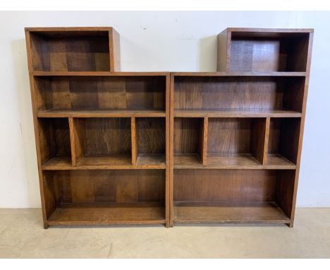 A pair of oak bookshelves with solid backs.W:142cm x D:24cm x H:108cmBookcase measurements: Entire bookcase: H:108cm, W:71cm.