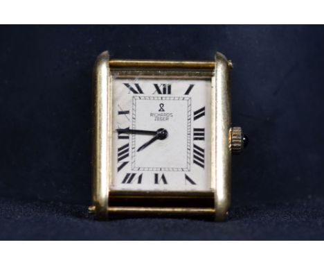 An 18ct gold gentlemans vintage wrist watch. Dial signed Richards Zegar . 22m x 24mm oblong case with cream face, roman numer
