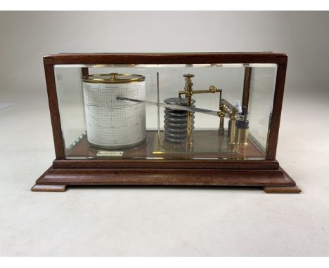 An Early 20th Century oak cased barograph by Weir & Sons of Dublin and Belfast, having five bevelled glass panels and standin