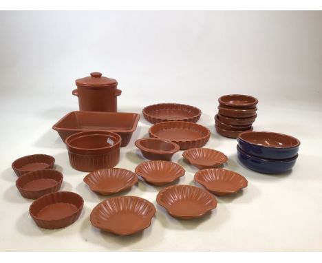 A collection of Oven to Table Honiton pottery with other items to include storage jar and flan dishes