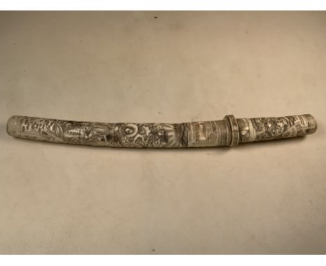 A Japanese Carved Bone Sword Katana, untampered blade, hilt and scabbard made from bone sections each nicely carved in relief