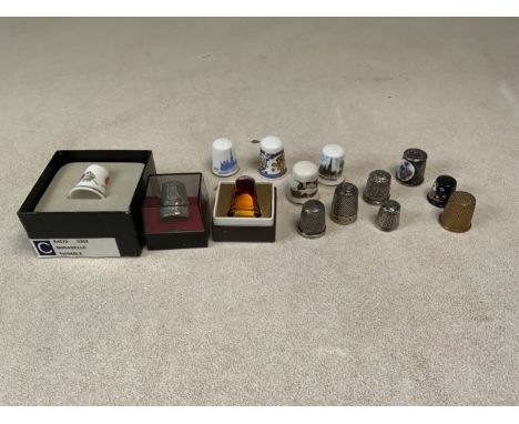 A collection of thimbles to include nursery Birchcroft, Wedgewood and four silver stamped thimbles.