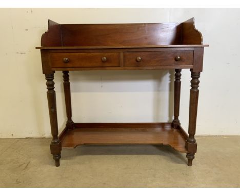 A mahogany washstand with solid wood gallery with two drawers and shelf below.W:98cm x D:43cm x H:95cm