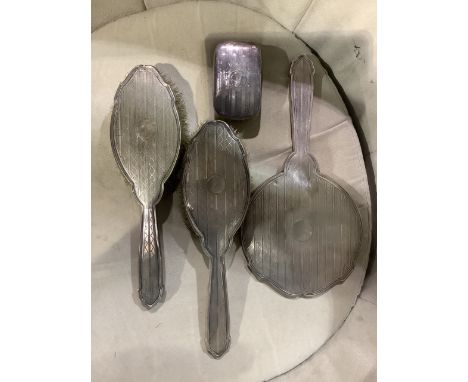 A sterling silver dressing table set with engine turned decoration by Henry Clifford Davis, Birmingham 1941.