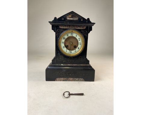 A French slate mantel clock with numbered movement. H:31cm