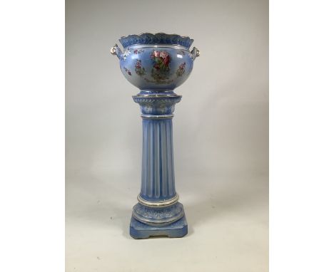 An early 20th century ceramic jardiniere with transfer printed roses and gilded edges. hairline crack to bowl. Gilding rubbed