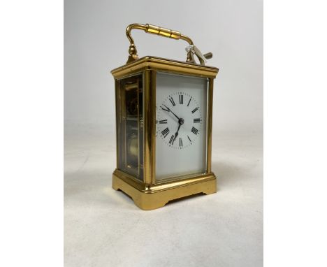 A late 19th early 20th century French four glass gilt brass carriage clock. Movement marked made in France and striking on a 