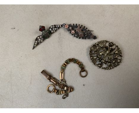 A white metal Scottish style brooch together with an unmarked yellow metal bracelet, a silver and yellow metal brooch and a s
