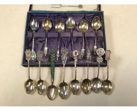 A collection of Chinese Export unmarked white metal and silver tea spoons to include a jade handled example.