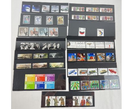 A collection of 13 Royal Mail mint collector stamp sets. To include: Brunel, James Bond, RSA, Vintage Toys and British Seasid