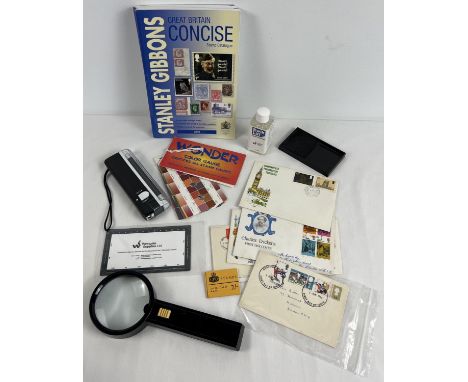 A collection of philately related items to include Stanley Gibbons Concise Stamp catalogue 2019, stamp tray, torch, magnifyin