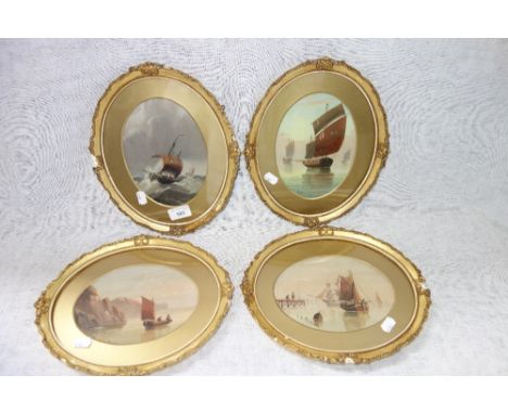 E K REDMORE 1860-1941: A set of four maritime paintings in oval gilt frames, oil on board