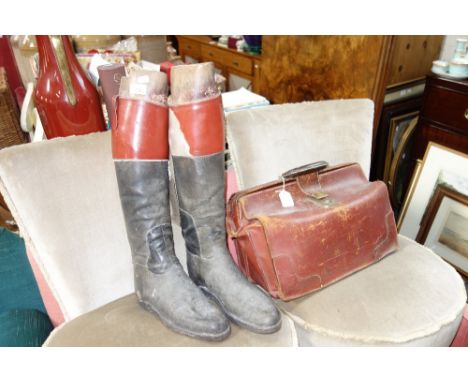 A PAIR OF VINTAGE RIDING BOOTS by Peal & Co London, with wooden stretchers and a Vintage leather case