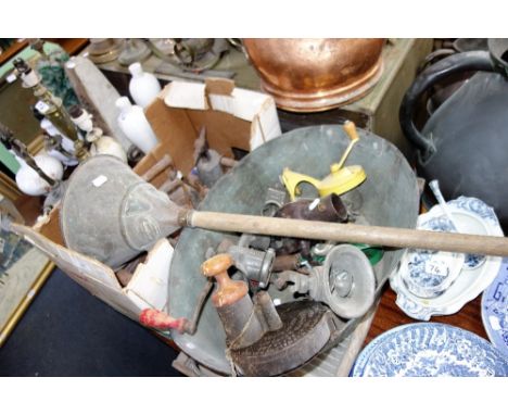 A COLLECTION OF VINTAGE CAST IRONS and kitchen implements