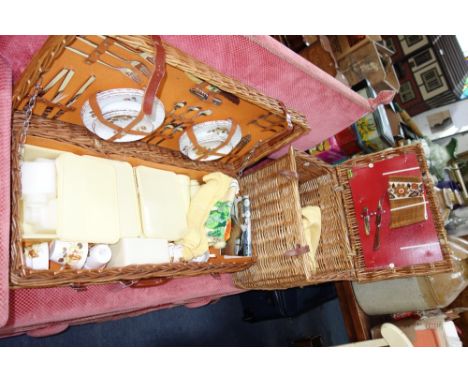 A LARGE VINTAGE PICNIC SET contained in a wicker basket and another similar