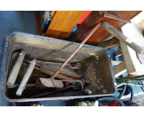 A COLLECTION OF VINTAGE AGRICULTURAL TOOLS, to include scythes and a peat cutter