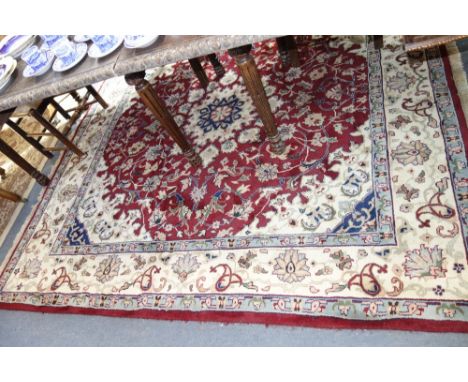 A PERSIAN DESIGN MEDALLION CARPET of square shape, 215 cms x 215 cms (plus fringes)