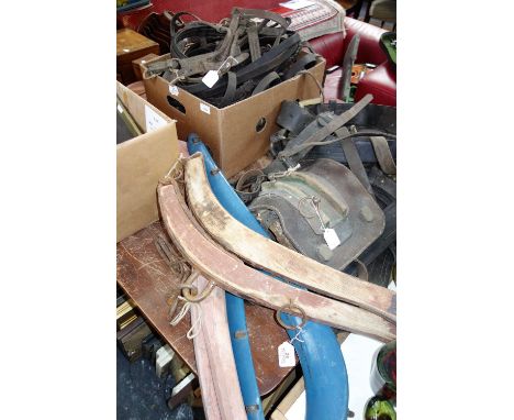 A LARGE COLLECTION OF VINTAGE EQUINE ITEMS, including a 19th century donkey britchen pad, leather driving reins, a cart harne