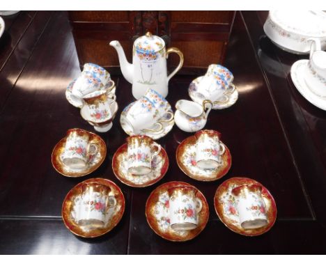 A WOODLANDS CHINA COFFEE SET comprising five tea cups and saucers, coffee pot, cream jug and similar coffee cups and saucers