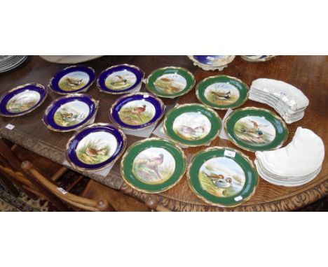 A SET OF SIX SPODE PLATES, each hand painted with different birds within a green and gilt border, a similar set of six within