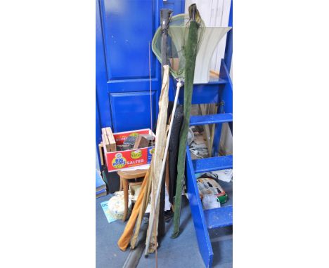 A COLLECTION OF VINTAGE FISHING EQUIPMENT, to include rods, a net, reels and flies
