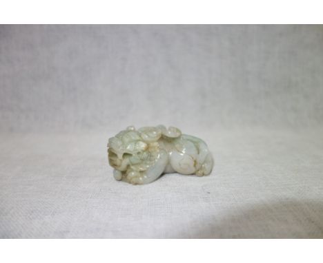A CHINESE JADE FIGURE of a dragon