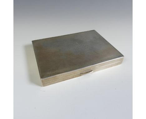 A sterling silver Cigarette Case, with London import marks for 1963, rectangular form with double hinge, engine turned decora