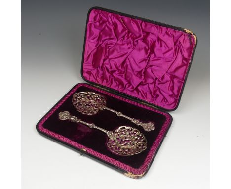 A pair of cased Victorian silver Serving Spoons, by William Hutton &amp; Sons, hallmarked London 1891, the bowls with pierced