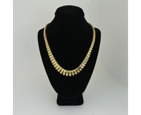 A 9ct yellow gold Fringe Necklace, the graduated rectangular drops with engine turned decoration, bolt ring clasp, 41cm long,