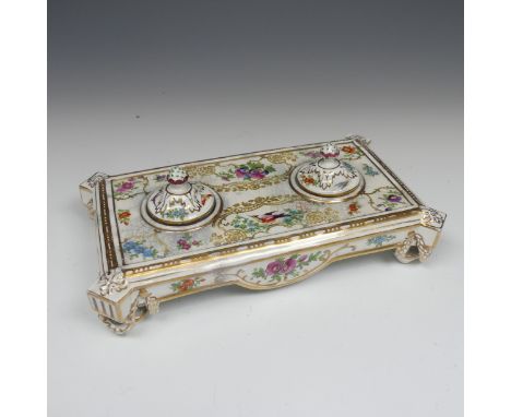 A 19thC English porcelain Inkstand, white ground decorated and over painted in floral sprays and exotic birds, with double in