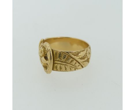 A Victorian 18ct yellow gold Buckle Ring, with foliate decoration, hallmarked Birmingham, 1894, Size M, 7.2g. 