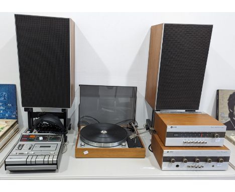 A harlequin Hi-Fi system, comprising of ; A Thorens TD 150/11 Turntable, a Leak Delta AM.FM Tuner, a Leak Delta 30 Amplifier,
