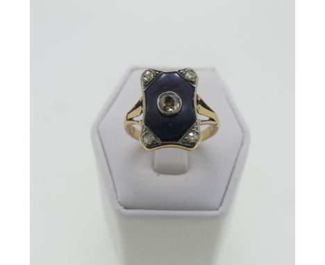 An Art Deco black onyx and diamond Ring, the shaped rectangular front with old cut central diamond approx. 0.2ct, collet set 