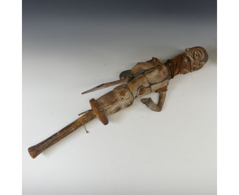 Tribal art; an early 20th century Ogoni (Nigeria) wooden Puppet, with turning head, articulated arms and jaw, the whole decor