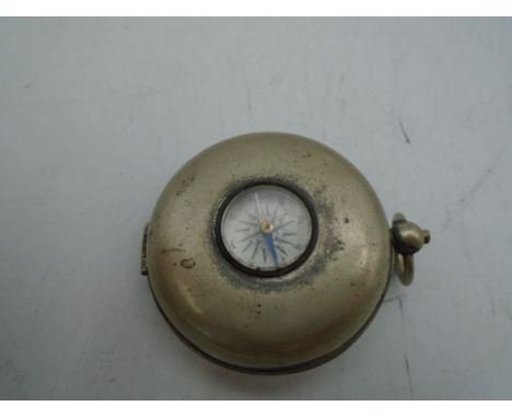 An antique compass pocket watch type case with expandable drinks cup inside