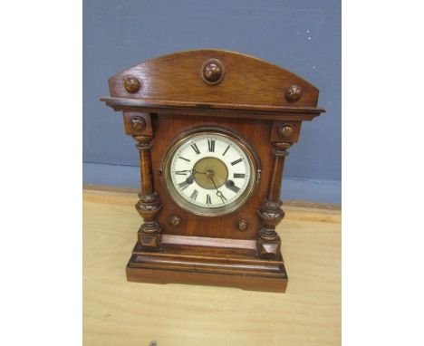 Oak framed mantel clock with key