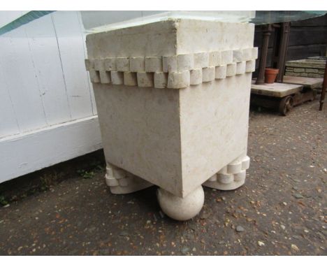 An ornate side table in the style of marble (very light resin) and glass top