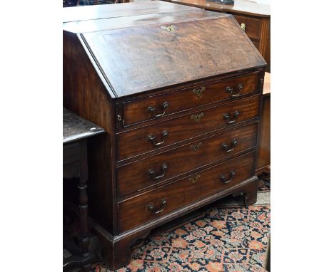 A George III mahogany fall front bureau with fitted interior and four long graduating drawers on shaped bracket feet, 100 cm 